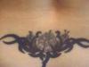 Lower tribal back piece tattoo