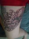 start of Japanese dragon thigh tattoo
