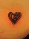 Small Tribal Style Heart tattoo