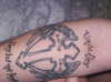 cross with angel wings and text tattoo