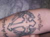 cross with angel wings and text tattoo