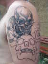 Skulls 1/2 done tattoo