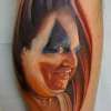 Gacey portrait tattoo