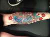 Japanese Koi bright blue on calf tattoo