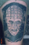 Pin head tattoo
