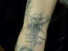 Screaming skull pentagram tattoo
