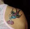 Swallow Bird with Cherries tattoo