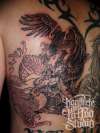 black and grey back piece tattoo