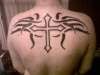 cross and tribal tattoo