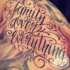 Family over everything freehand script tattoo