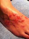Flowers on foot tattoo