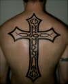 Gothic tribal cross tattoo