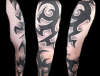 Tribal sleeve shaded tattoo