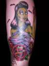 Zombie Girl holding hart (on left shin) tattoo