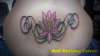 lotus on lower back tattoo