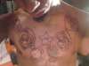 mario  brothers cabra chest piece tattoo