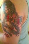 Dragon with hint of red tattoo