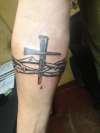 Thorns with cross tattoo