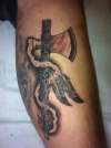 Peace pipe tomahawk tattoo