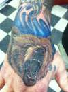 bear on hand tattoo