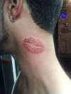 kiss on neck tattoo