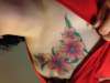 painful flowers tattoo