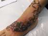 Flowers and vine tattoo
