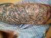 Music maths and birds sleeve tattoo