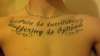 "Pain is Inevitable, Suffering is Optional" chestpiece tattoo
