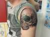 Skull piece tattoo