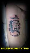 buddha face in letter tattoo