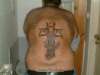 alien cross tattoo
