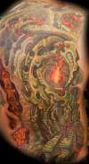 Biomech candle cover up by Beto Munoz tattoo