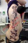 Sexy side flowers and skulls tattoo