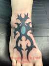 Tribal foot tattoo