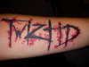 twizted by Dennis Smith tattoo