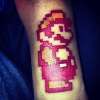 8 bit Fire Mario tattoo