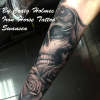 Skull and roses sleeve tattoo by Craig Holmes
