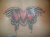 winged hearts tattoo