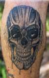 Black and grey scull tattoo