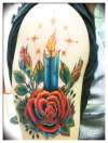 Rose and candle tattoo