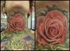Rose throat tattoo