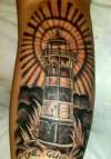 black and grey lighthouse tattoo