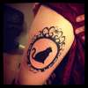 Cat in a frame tattoo