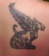 Cat with wings tattoo