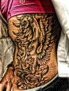 Phoenix rib tattoo