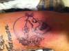 Skull with roses tattoo