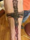 a coverup of another cross tattoo