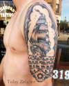 Sailboat half sleeve tattoo