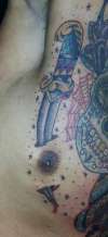 dagger through nipple tattoo